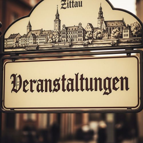 a sign with a picture of a town
